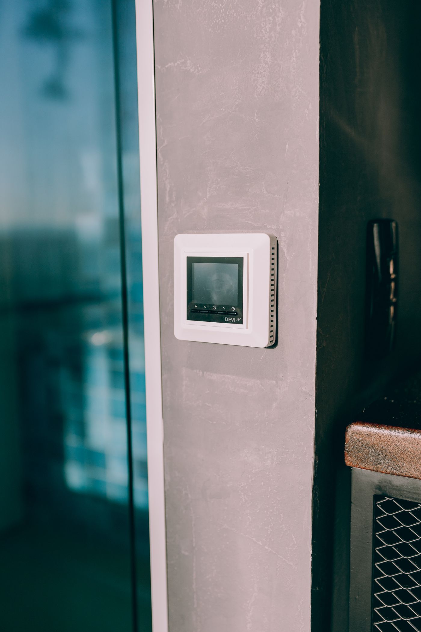 Digital wall thermostat controlling a home heating and cooling system